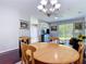 Spacious dining area adjacent to the living room, filled with natural light at 10323 Birdwatch Dr, Tampa, FL 33647