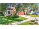 This lovely single-Gathering home features a spacious front lawn and a two-car garage at 10323 Birdwatch Dr, Tampa, FL 33647