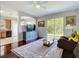 Open living space leading to the kitchen, with sliding door access to the backyard at 10323 Birdwatch Dr, Tampa, FL 33647