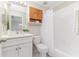 Clean bathroom features a shower with curtain, a white vanity, and a modern sink at 10364 Lightner Bridge Dr, Tampa, FL 33626