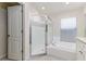 Well-appointed bathroom featuring a glass shower, soaking tub, and modern fixtures at 10364 Lightner Bridge Dr, Tampa, FL 33626