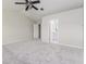 Bedroom featuring neutral carpet, a ceiling fan, and bathroom access at 10364 Lightner Bridge Dr, Tampa, FL 33626
