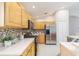 Modern kitchen featuring stainless steel appliances, mosaic backsplash, and ample counter space at 10364 Lightner Bridge Dr, Tampa, FL 33626