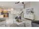 Open concept living area with kitchen, stairs, living room, and stylish furnishings at 10364 Lightner Bridge Dr, Tampa, FL 33626