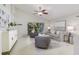 Bright living room with large windows, stylish furniture, and easy access to the kitchen at 10364 Lightner Bridge Dr, Tampa, FL 33626