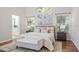 Bright main bedroom featuring a large window, natural light, and calming decor at 10364 Lightner Bridge Dr, Tampa, FL 33626