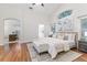 Bright and airy main bedroom boasts high ceilings, creating a serene and inviting atmosphere at 10364 Lightner Bridge Dr, Tampa, FL 33626