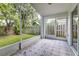 Tiled screened patio offers a relaxing outdoor space with views of the fenced backyard at 10364 Lightner Bridge Dr, Tampa, FL 33626