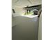 Garage interior features a painted floor and overhead lighting at 10999 Del Prado E Dr, Largo, FL 33774