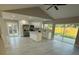 Bright kitchen features stainless steel appliances, white cabinets, and a center island with quartz countertops at 10999 Del Prado E Dr, Largo, FL 33774