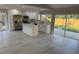 Modern kitchen with stainless steel appliances, quartz countertops, and sleek white cabinets at 10999 Del Prado E Dr, Largo, FL 33774