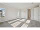 Spacious bedroom with neutral carpet, and tray ceiling at 11622 Gleaming Ter, Venice, FL 34293