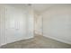 Carpeted bedroom with ample closet space provided by large double-door closet with interior shelves at 11622 Gleaming Ter, Venice, FL 34293