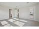 Large bedroom with carpet and doorway leading to bathroom and kitchen at 11622 Gleaming Ter, Venice, FL 34293