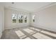 Bright, open bedroom with natural light, carpet flooring and tray ceiling at 11622 Gleaming Ter, Venice, FL 34293