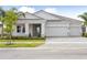 Charming single Gathering home with manicured landscaping and a three-car garage at 11622 Gleaming Ter, Venice, FL 34293