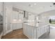 Modern, spacious kitchen with white cabinets, stainless steel appliances, and a large island at 11622 Gleaming Ter, Venice, FL 34293