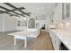 Bright kitchen featuring an island with a countertop, modern cabinets, and an open layout at 11622 Gleaming Ter, Venice, FL 34293