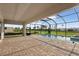 Screened-in pool area features brick pavers, a gorgeous pool, and a lovely yard at 11622 Gleaming Ter, Venice, FL 34293
