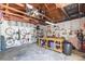 Functional garage interior with workbench, bikes, storage, and ample space for projects and organization at 1202 E Mohawk Ave, Tampa, FL 33604