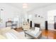 Cozy living room features hardwood floors, fireplace with stylish accents, and plenty of natural light at 1202 E Mohawk Ave, Tampa, FL 33604
