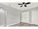 Neutral bedroom features new flooring, baseboards, updated lighting and closet at 1223 Jasmine Way, Clearwater, FL 33756