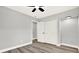 Neutral bedroom features new flooring, baseboards, updated lighting and closet at 1223 Jasmine Way, Clearwater, FL 33756