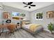Comfortable bedroom featuring a desk, and large windows providing plenty of natural light at 1223 Jasmine Way, Clearwater, FL 33756
