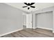 Bright bedroom featuring wood-look floors and a ceiling fan at 1223 Jasmine Way, Clearwater, FL 33756