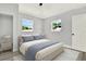 Serene bedroom with a comfortable bed, natural lighting, and minimalist decor at 1223 Jasmine Way, Clearwater, FL 33756