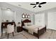 Bedroom with a desk, natural lighting, and closet at 1223 Jasmine Way, Clearwater, FL 33756