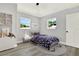 Charming bedroom featuring playful decor, comfortable bed, and ample natural light at 1223 Jasmine Way, Clearwater, FL 33756