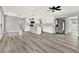 Spacious open-concept living space features sleek floors, modern kitchen, and stainless steel appliances at 1223 Jasmine Way, Clearwater, FL 33756