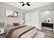 Inviting main bedroom featuring a cozy bed, modern decor, and soft lighting at 1223 Jasmine Way, Clearwater, FL 33756