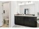 Bathroom featuring double sink vanity with granite countertops and tile floors at 12351 Nouveau Ave, Spring Hill, FL 34610