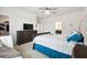 Comfortable main bedroom with dresser, TV, and ensuite bathroom at 12351 Nouveau Ave, Spring Hill, FL 34610