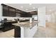 Spacious kitchen with granite countertops, stainless steel appliances, and a center island at 12351 Nouveau Ave, Spring Hill, FL 34610