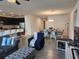 Spacious living space boasts an open layout connecting kitchen and dining at 12351 Nouveau Ave, Spring Hill, FL 34610