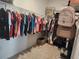 Spacious walk-in closet with organized clothing racks and shelving, providing ample storage space at 12351 Nouveau Ave, Spring Hill, FL 34610