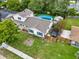 Aerial view captures a home with a pool, shed, and well-maintained yard at 1305 Willow Valley Dr, Brandon, FL 33510