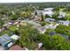 Aerial view of a residential street with various homes, mature trees, and well-maintained lawns at 1305 Willow Valley Dr, Brandon, FL 33510
