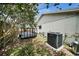 The backyard features a trailer, AC unit, and mature trees, creating privacy at 1305 Willow Valley Dr, Brandon, FL 33510