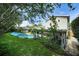 The home features a tranquil backyard with a pool, shed, and patio area at 1305 Willow Valley Dr, Brandon, FL 33510