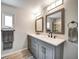 Bright bathroom featuring a double vanity, modern lighting, and a sleek glass-enclosed shower at 1305 Willow Valley Dr, Brandon, FL 33510