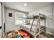 bedroom featuring a bunk bed and themed rug at 1305 Willow Valley Dr, Brandon, FL 33510