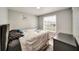 Bedroom featuring hardwood floors, and a large window for natural light at 1305 Willow Valley Dr, Brandon, FL 33510