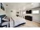Comfortable bedroom with a large bed, dresser, and a mirrored closet providing ample storage at 1305 Willow Valley Dr, Brandon, FL 33510
