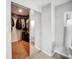 Walk-in closet with ample storage space and mirrored doors, complemented by a modern air conditioning unit at 1305 Willow Valley Dr, Brandon, FL 33510