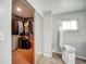 Walk-in closet with ample storage space and mirrored doors, complemented by a modern air conditioning unit at 1305 Willow Valley Dr, Brandon, FL 33510
