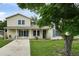 Charming home with well-manicured lawn, complemented by a beautiful tree and a welcoming entrance at 1305 Willow Valley Dr, Brandon, FL 33510